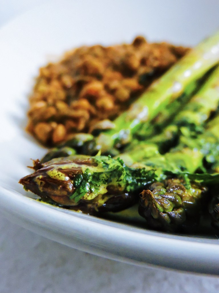 Grilled asparagus plated with a lentil stew from Ecuador.